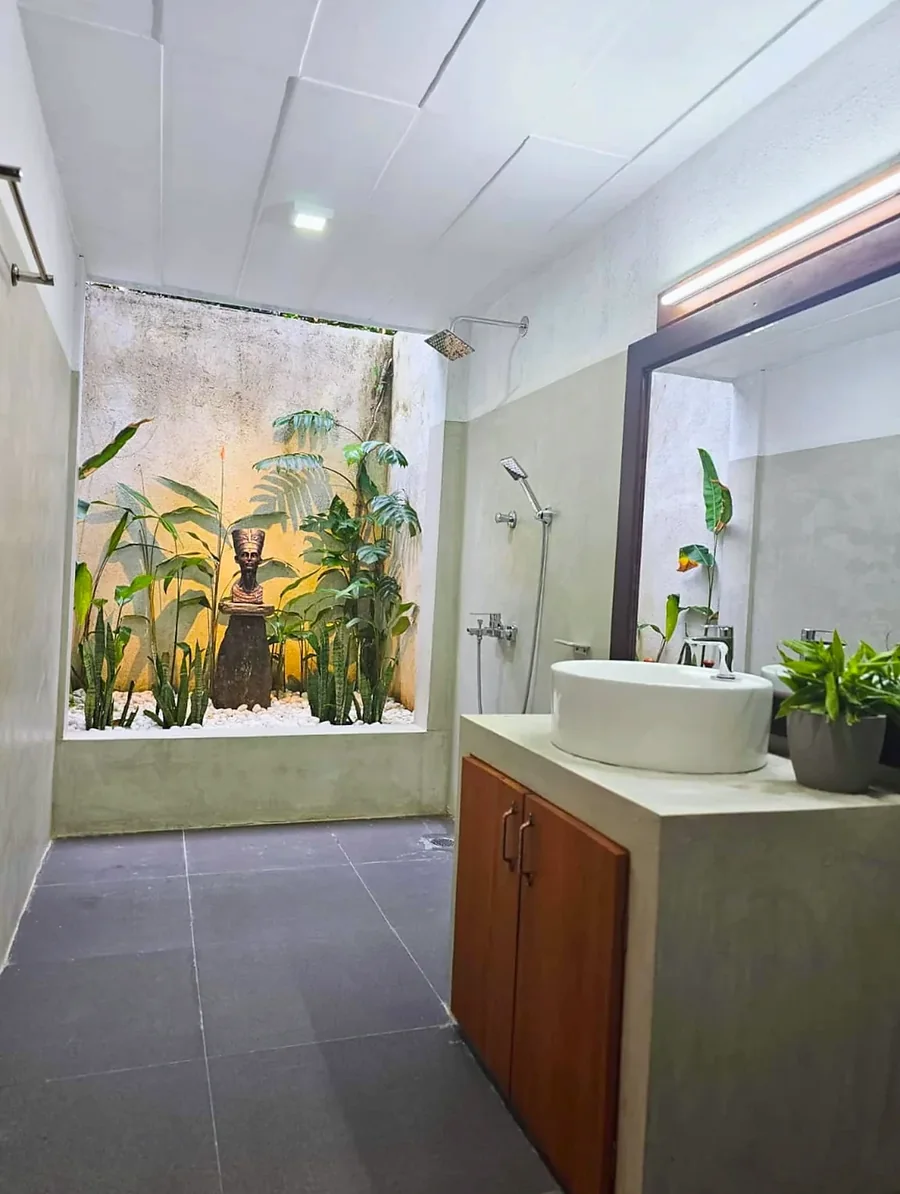 Bathroom with a wooden vanity and garden-side window — Syndeo Garden, Hikkaduwa