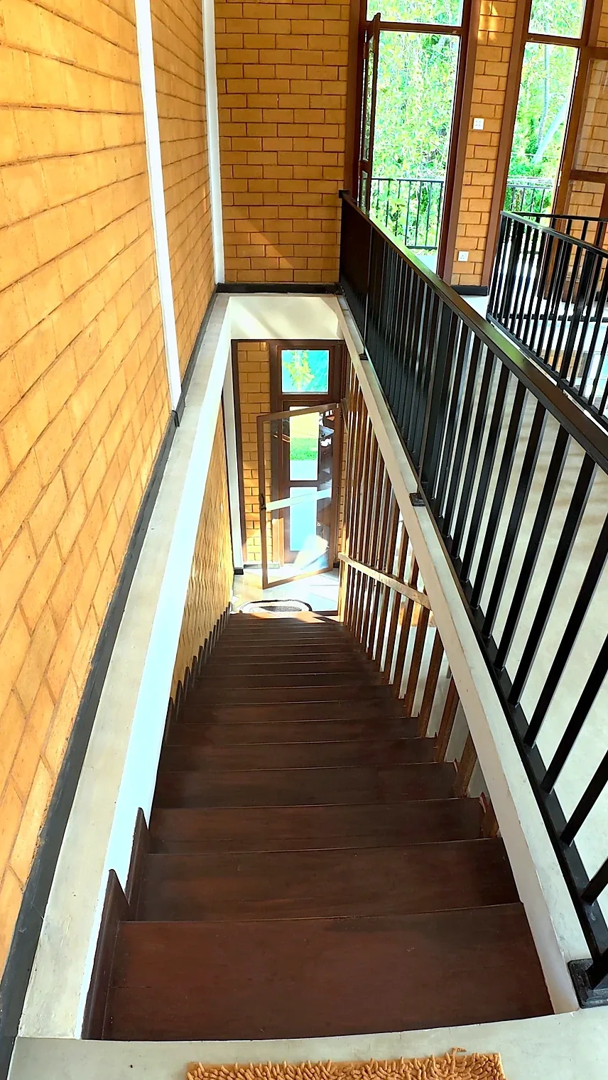 Wooden staircase and upper gallery — Syndeo Garden, Hikkaduwa